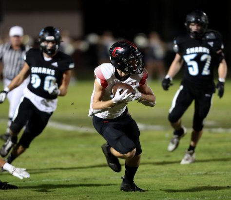 Creekside receiver Jack Goodrich, center, makes a catch and run in the first quarter during a Week 10 game at Ponte Vedra. (Ralph D. Priddy) (News4Jax)