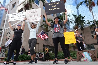 People who oppose mandatory wearing of masks in schools protest at the Broward County School District headquarters in Fort Lauderdale on Tuesday. Sun Sentinel